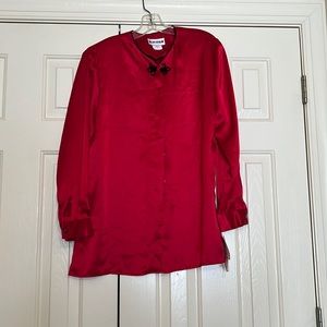 Smooth red blouse with covered buttons